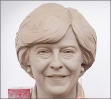 Touching up Mrs May at Madame Tussauds