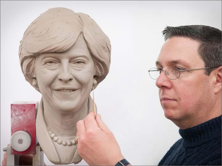 Principal Sculptor Stephen Mansfield with the finished clay head of Theresa May's wax figure.