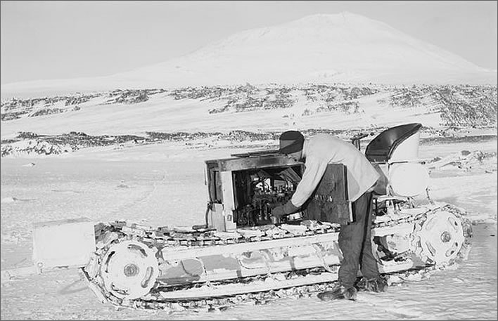 Terra Nova expedition: Bernard Day working on the engine of one of the motor tractors.