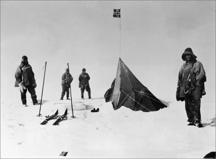 Terra Nova expedition: Four of the Polar Party standing disconsolately around Amundsen's tent.