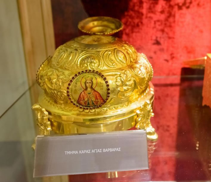 A skull in a gilded pot in a display case in the monastery of Mega Spileo in Kalavryta, Greece.