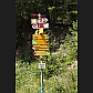 A well loaded Swiss 'Wanderweg' signpost. The pale yellow sign near the top directs us to Salaschigns.